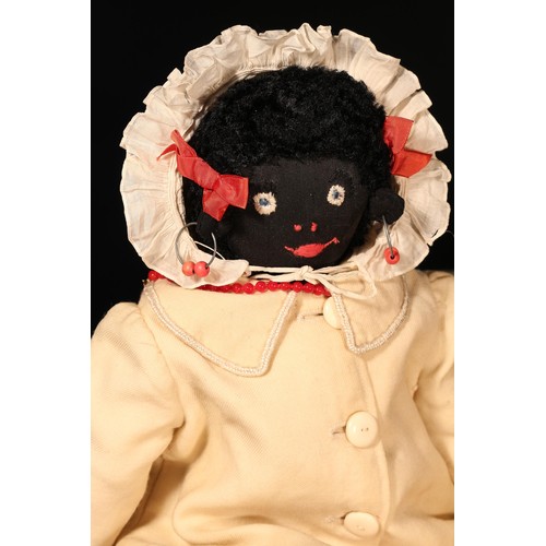 4141 - Folk Art - an early 20th century stuffed cloth black doll, the fabric head applied with black boot b... 