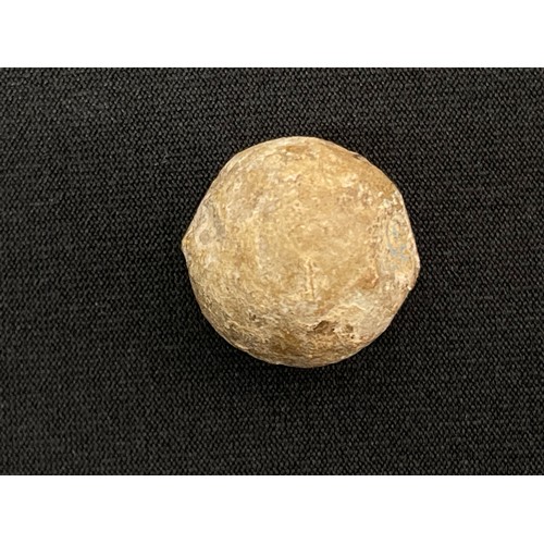 2049 - A cannon ball approx. 85mm in diameter of unknown origin on a rock display mount; An American Civil ... 