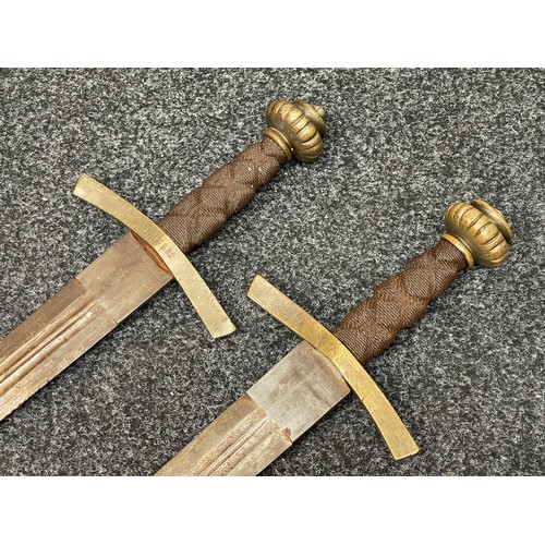 2054 - Matching pair of German film prop Swords with double edged fullered blades 800mm in length, blunt ti... 