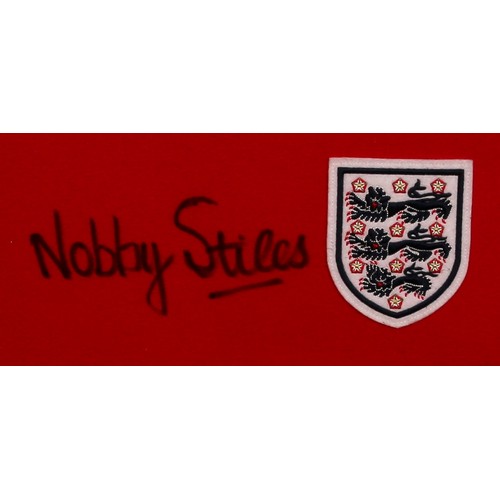 6318 - Sport, Football, Autographs - a 1966 England F.C. replica shirt, signed in black pen by Nobby STILES... 