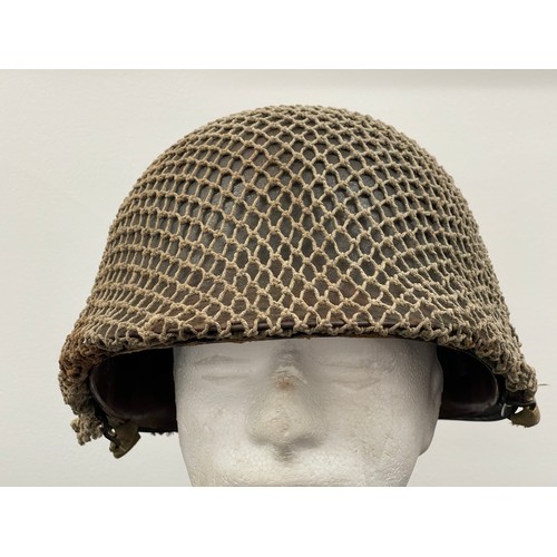 2113 - WW2 US M1 Helmet with swivel bale chinstrap. Rear seam. Heat stamp number 117B. Fitted with a postwa... 