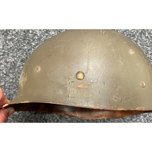 2113 - WW2 US M1 Helmet with swivel bale chinstrap. Rear seam. Heat stamp number 117B. Fitted with a postwa... 