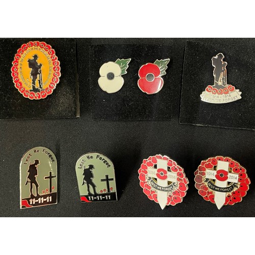 2238 - Enamel Poppy Day lapel badges to include: four 1914-2014 Lest We Forget badges: three 