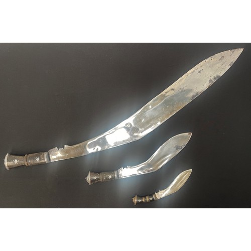 2247 - Three Kukri Knives: one very large example with 750mm long blade. Overall length 885mm. Complete wit... 