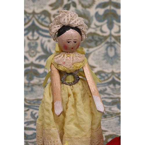 6288 - Folk Art - an early 20th century Grödnertal or 'Dutch' peg doll, the carved and painted head with pa... 