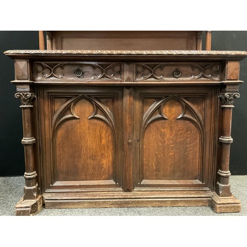 42 - A Victorian oak Gothic Revival Chiffonier, carved and pierced three-quarter galleried top with finia... 