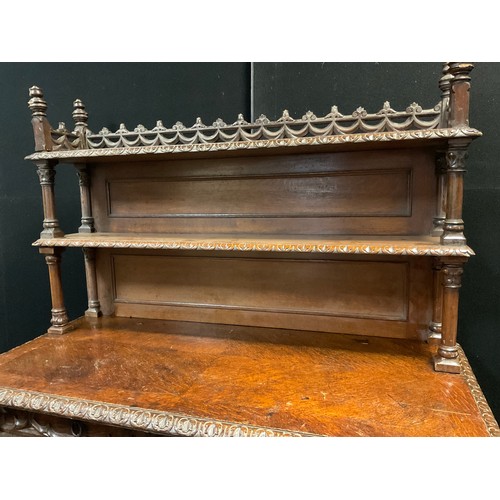 42 - A Victorian oak Gothic Revival Chiffonier, carved and pierced three-quarter galleried top with finia... 