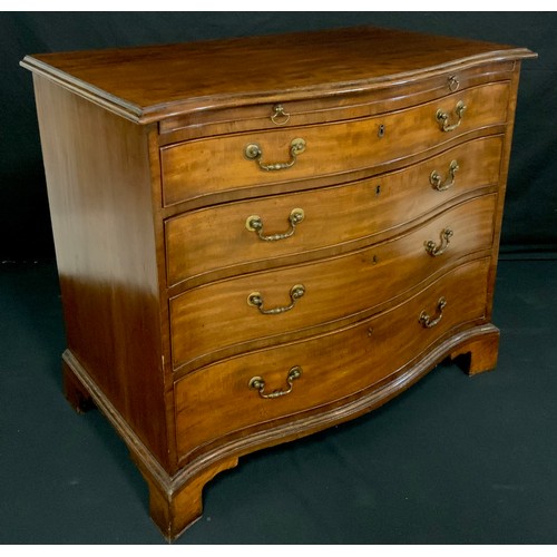 44 - A George III mahogany serpentine bachelor’s chest, fiddleback top above a slide and four long gradua... 