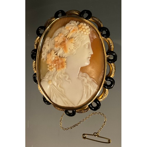 469 - A Victorian cameo brooch, carved as Bacchante with a grape garland to her hair, unmarked yellow meta... 