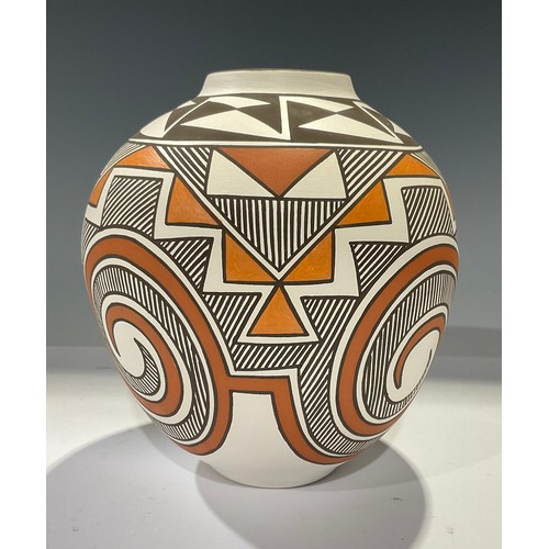 9 - An ovoid Acoma vase, by R Patricio, signed, typically hand decorated with geometric shapes in ochre ... 