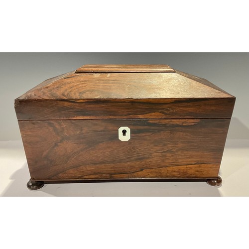 29 - A William IV rosewood sarcophagus tea caddy, hinged cover enclosing two lidded compartments and mixi... 