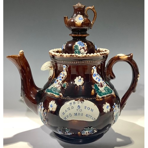 39 - A late 19th century barge ware teapot, treacle glaze, 
