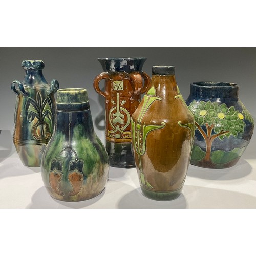 40 - An Belgian Art Pottery four handled sleeve vase, incised decoration with typical Art Nouveau motifs ... 
