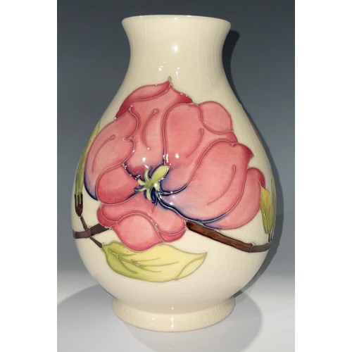 63 - A Moorcroft Magnolia pattern baluster vase, 19cm, impressed and painted marks