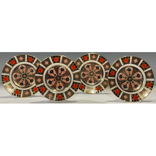 65 - A set of four Royal Crown Derby 1128 Imari pattern tea plates, 16cm diameter, first quality