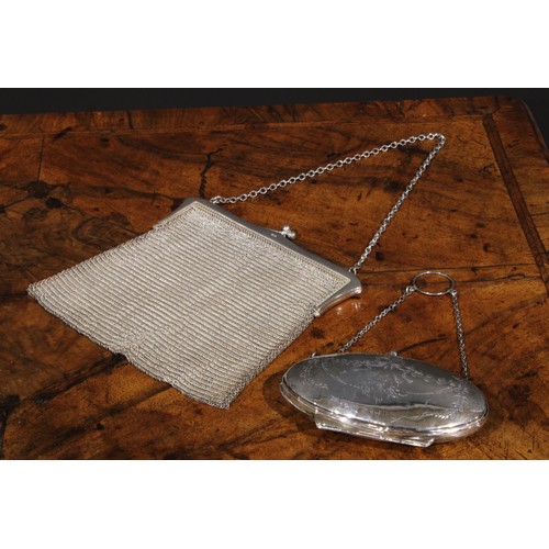 67 - A George V silver mesh evening purse, 16cm wide, London 1922, 216g; another purse, engraved with rib... 