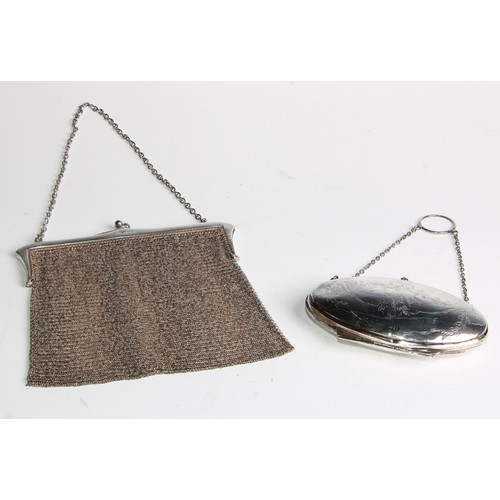 67 - A George V silver mesh evening purse, 16cm wide, London 1922, 216g; another purse, engraved with rib... 