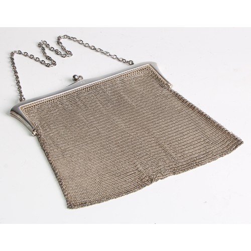 67 - A George V silver mesh evening purse, 16cm wide, London 1922, 216g; another purse, engraved with rib... 