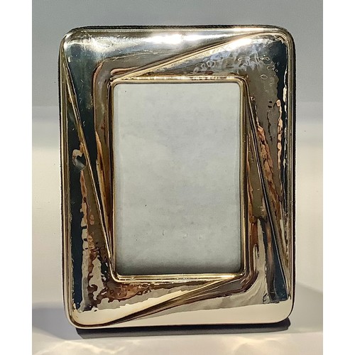 77 - A silver photograph frame, 13cm high