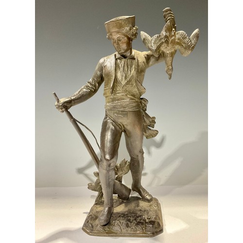 80 - A Victorian spelter figure, Young Sportsman, with rifle and game, 32cm high