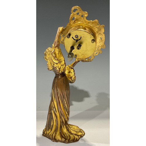 93 - An Art Nouveau gilt metal timepiece, modelled as a maiden wearing long flowing dress, 23.5cm high