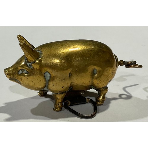 96 - Needlework Interest - a Victorian novelty tape measure, as a pig, the tail as a winder, 7cm long