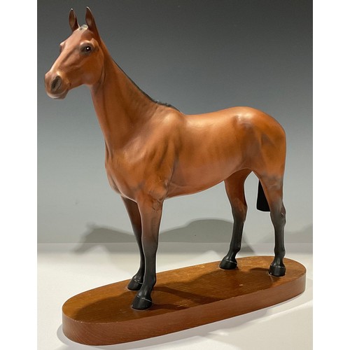 162 - A Beswick model, of a horse, Arkle Champion Steeplechasser, mounted on wooden base, 30cm high