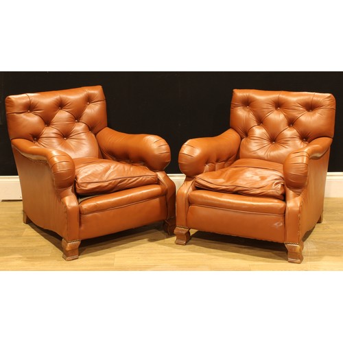 101 - A pair of easy chairs, in the manner of Howard & Sons, 82cm high, 78cm wide, the seat 46cm wide and ... 