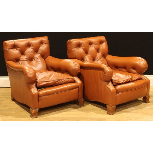 101 - A pair of easy chairs, in the manner of Howard & Sons, 82cm high, 78cm wide, the seat 46cm wide and ... 