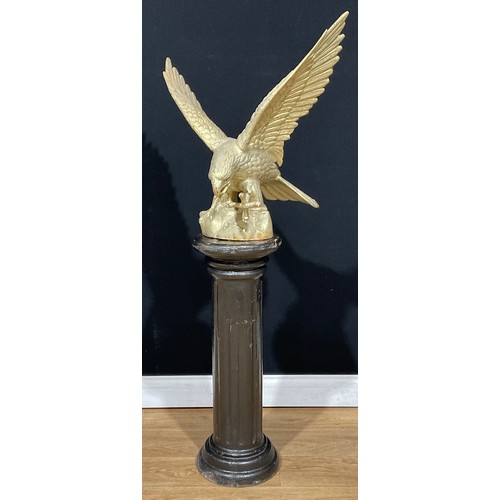 106 - A large Japanese Meiji style cast iron model, of an eagle, 62cm high, 63cm wide; a cast iron statuar... 