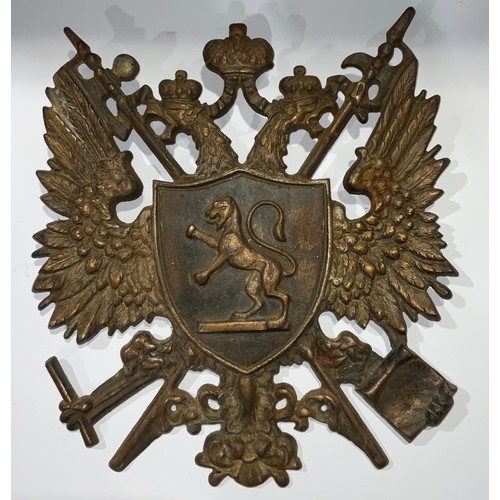 534 - A late 19th/early 20th century cast iron armorial crest, double headed eagle, 38cm high