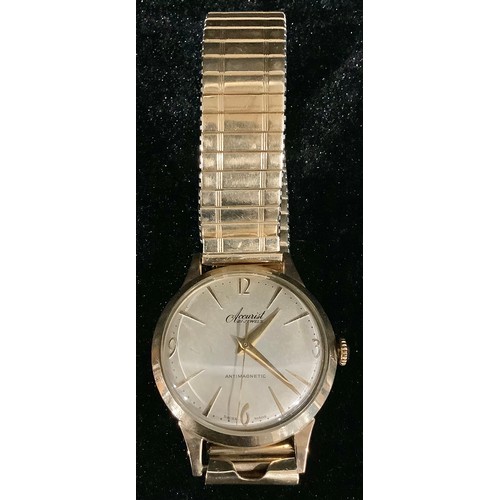 554 - A 9ct gold Accurist 21 jewel wristwatch, champagne dial, gold plated strap