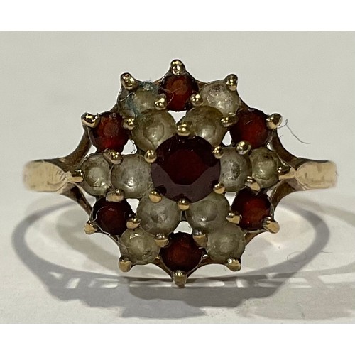 561 - A 9ct gold dress ring, set red and white stones, size P