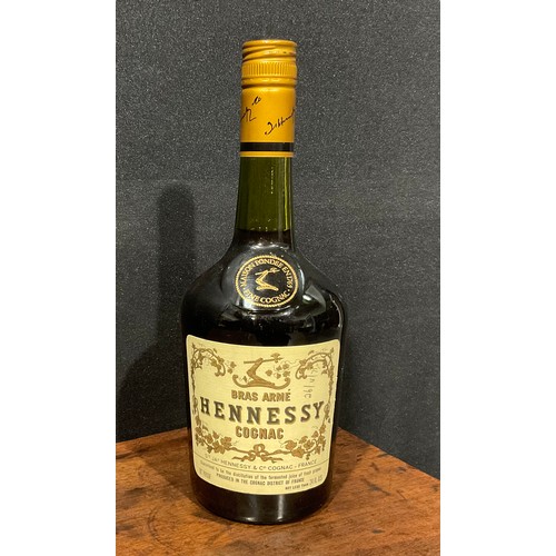 869 - Bras Armé Hennessy Cognac, 24fl ozs, level low neck, seal intact