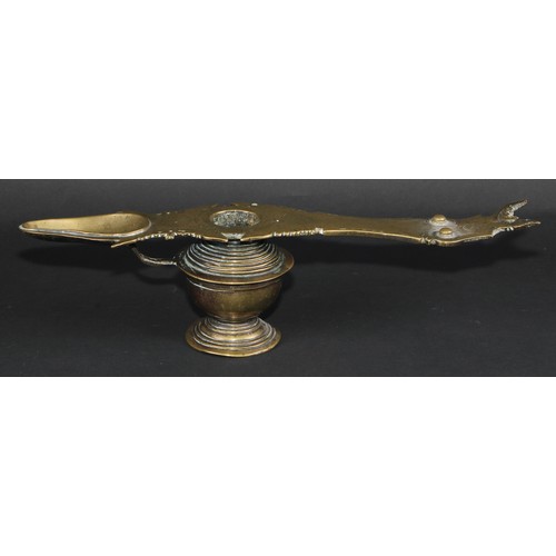 64 - A 19th century Indian bronze lamp, 38cm long