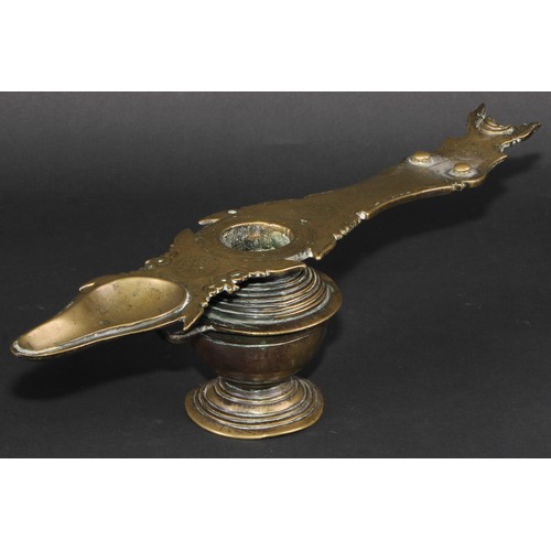 64 - A 19th century Indian bronze lamp, 38cm long