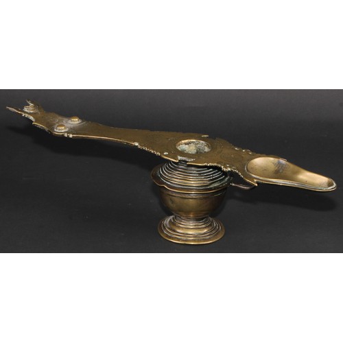 64 - A 19th century Indian bronze lamp, 38cm long