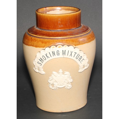 696 - A 19th century salt glazed inverted baluster tobacco jar, applied with sprigged royal coat of arms a... 