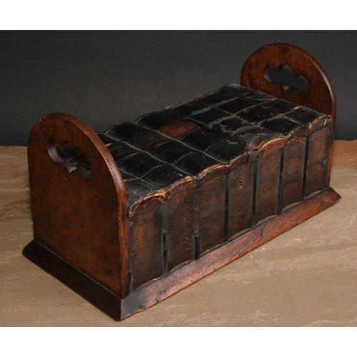 269 - A late 19th/early 20th century novelty oak cigar box, as a folding book rack with seven leather boun... 