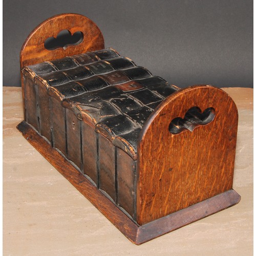 269 - A late 19th/early 20th century novelty oak cigar box, as a folding book rack with seven leather boun... 