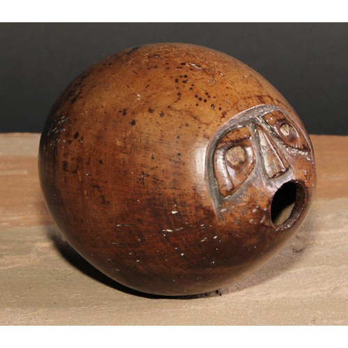 36 - A 19th century coconut bugbear, carved with a grotesque face, 12cm long, c.1870