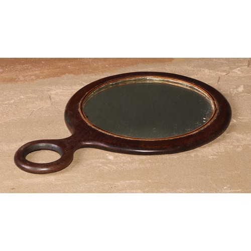 219 - A George III mahogany hand mirror, outlined with boxwood and ebony stringing, 20.5cm long, early 19t... 