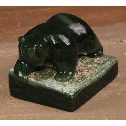 135 - A Canadian Inuit nephrite jade carving, of a bear, rectangular base, 8.5cm high