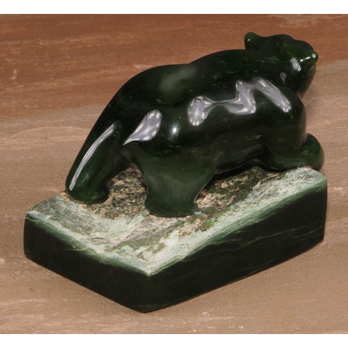 135 - A Canadian Inuit nephrite jade carving, of a bear, rectangular base, 8.5cm high