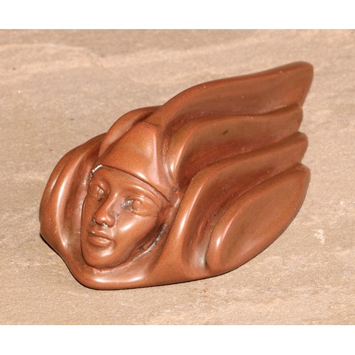 229 - A German jugendstil design achatit type desk weight, as a fluid kinematic mask, 12cm long