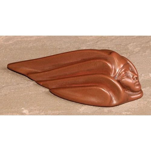 229 - A German jugendstil design achatit type desk weight, as a fluid kinematic mask, 12cm long