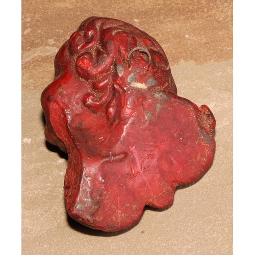 108 - A 19th century wax applique, moulded as the head of a putto, 10cm long