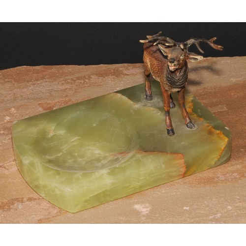 446 - An Austrian cold painted bronze, of a stag, mounted on a green onyx dish, 14cm long, c.1930