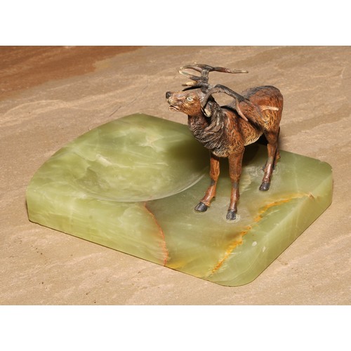 446 - An Austrian cold painted bronze, of a stag, mounted on a green onyx dish, 14cm long, c.1930