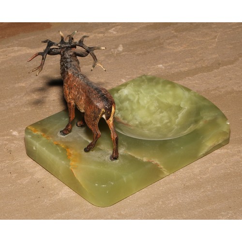 446 - An Austrian cold painted bronze, of a stag, mounted on a green onyx dish, 14cm long, c.1930